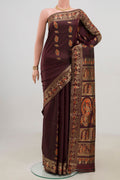 Coffee Brown Baluchari Silk Saree with Zari Butta on the body and Zari Border.  displayed on a mannequin