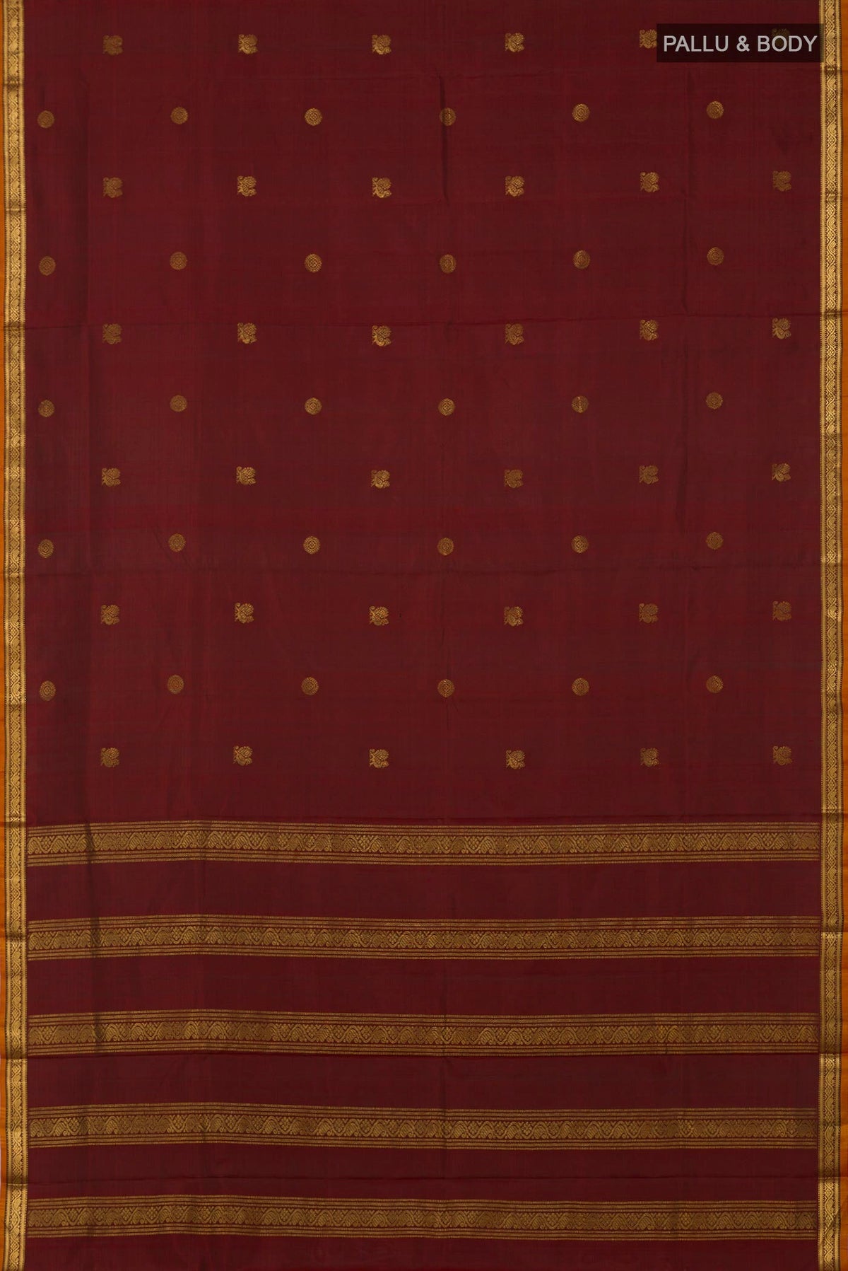 Flat view of Maroon Kanchipuram Silk Saree with Zari Butta on the body and Zari Border. 