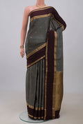 Grey Kanchipuram Silk Saree with Zari Butta on the body and Zari Border.  displayed on a mannequin