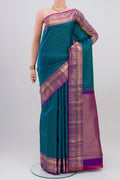 Peacock Blue Kanchipuram Saree with Checked design on the body and Zari Border.  displayed on a mannequin