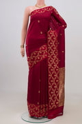 Maroon Banarasi Katan Silk Saree with Zari Butta on the body and Fancy Border.  displayed on a mannequin