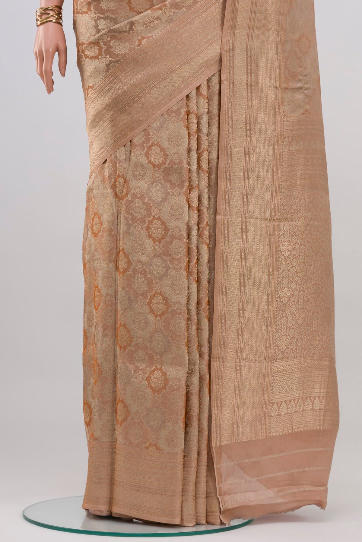 Pleats and pallu of Rose Gold Crepe Saree with Zari Brocade on the body and Zari Border. 