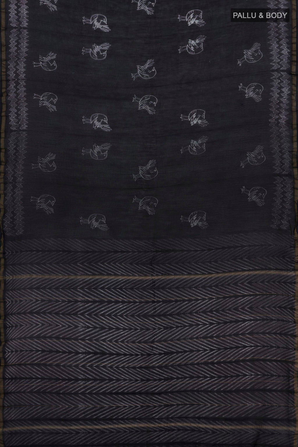 Flat view of Black Chanderi Silk Cotton Saree with Printed design on the body and Thin Zari Line. 