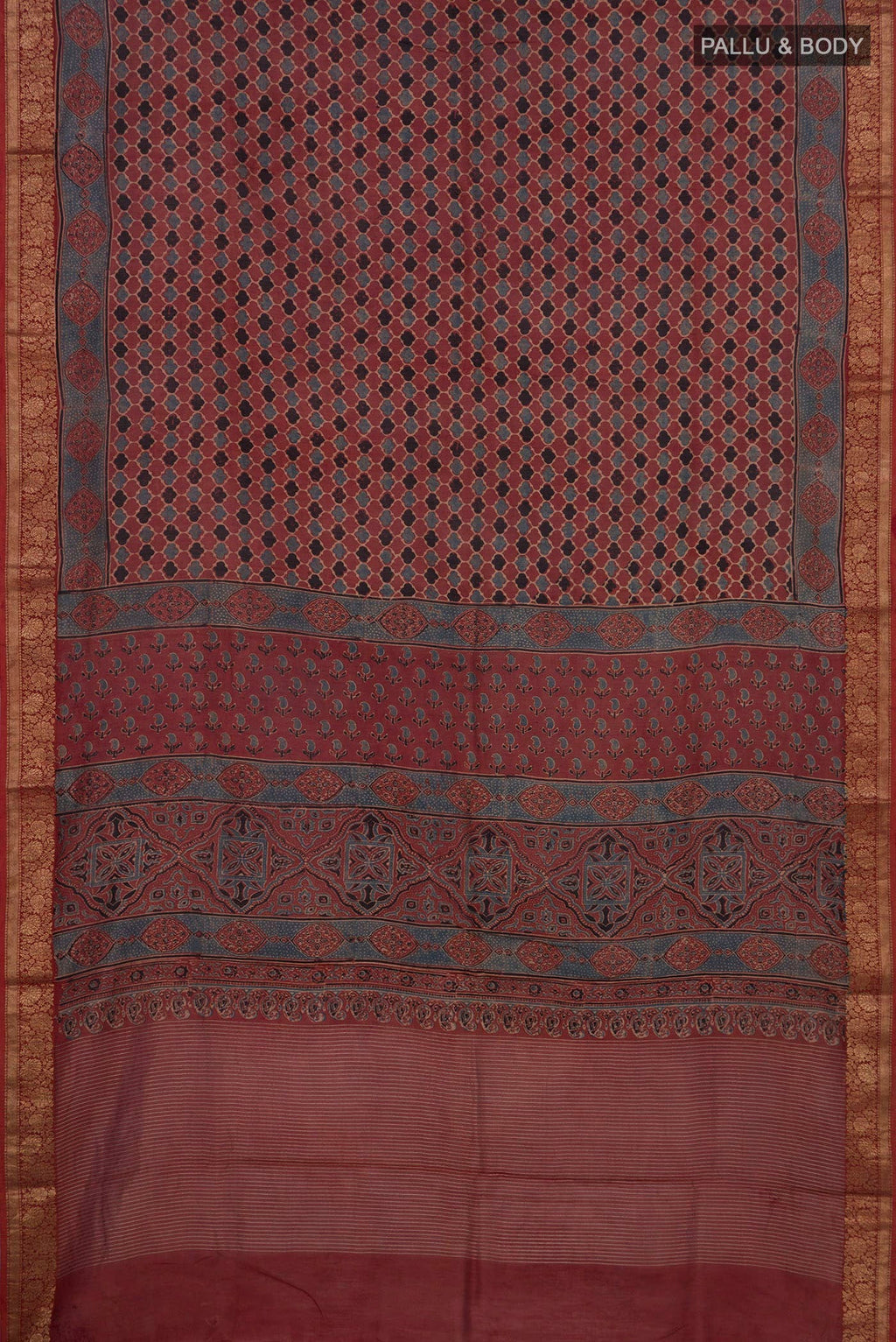 Flat view of Rust Chanderi Silk Cotton Saree with Ajrakh Print on the body and Zari Border. 