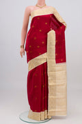 Maroon Kanjivaram Silk Saree with Zari Butta on the body and Zari Border.  displayed on a mannequin