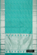 Sea Green Dual Tone Kanchipuram Silk Saree with Zari Brocade on the body and Zari Border.  displayed on a mannequin