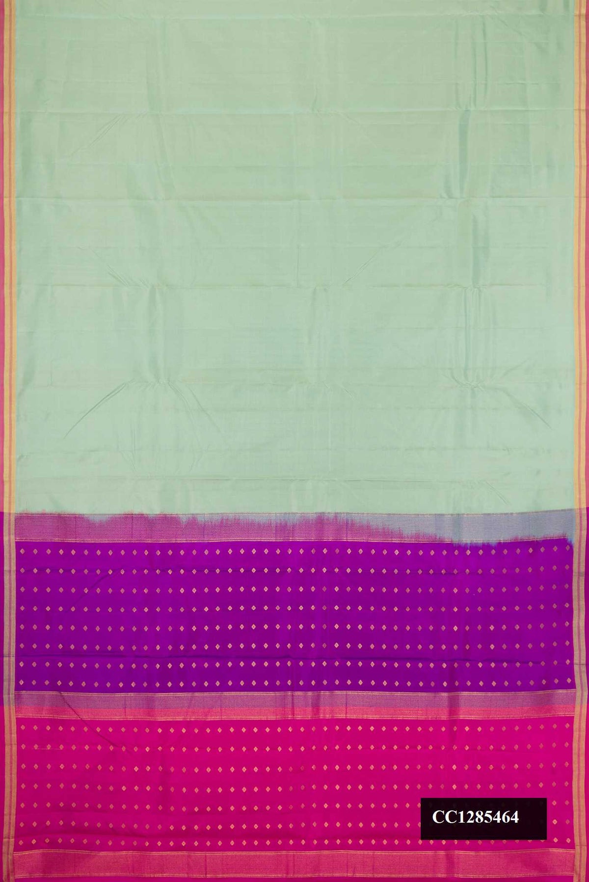 Pista Green Dual Tone Kanchipuram Silk Saree with Stripes on the body and Zari Border.  displayed on a mannequin