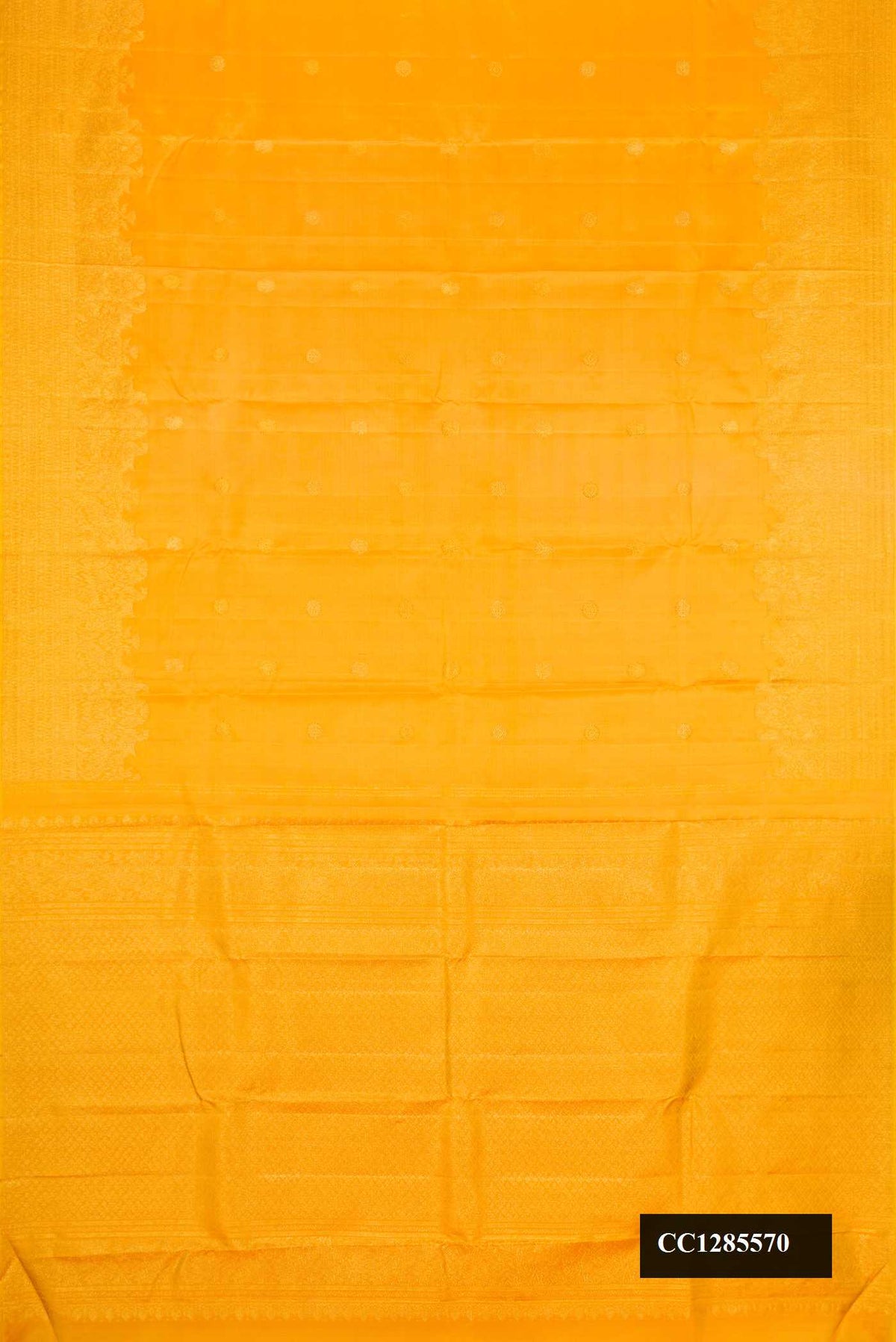 Yellow Dual Tone Kanchipuram Silk Saree with Zari Butta on the body and Zari Border.  displayed on a mannequin