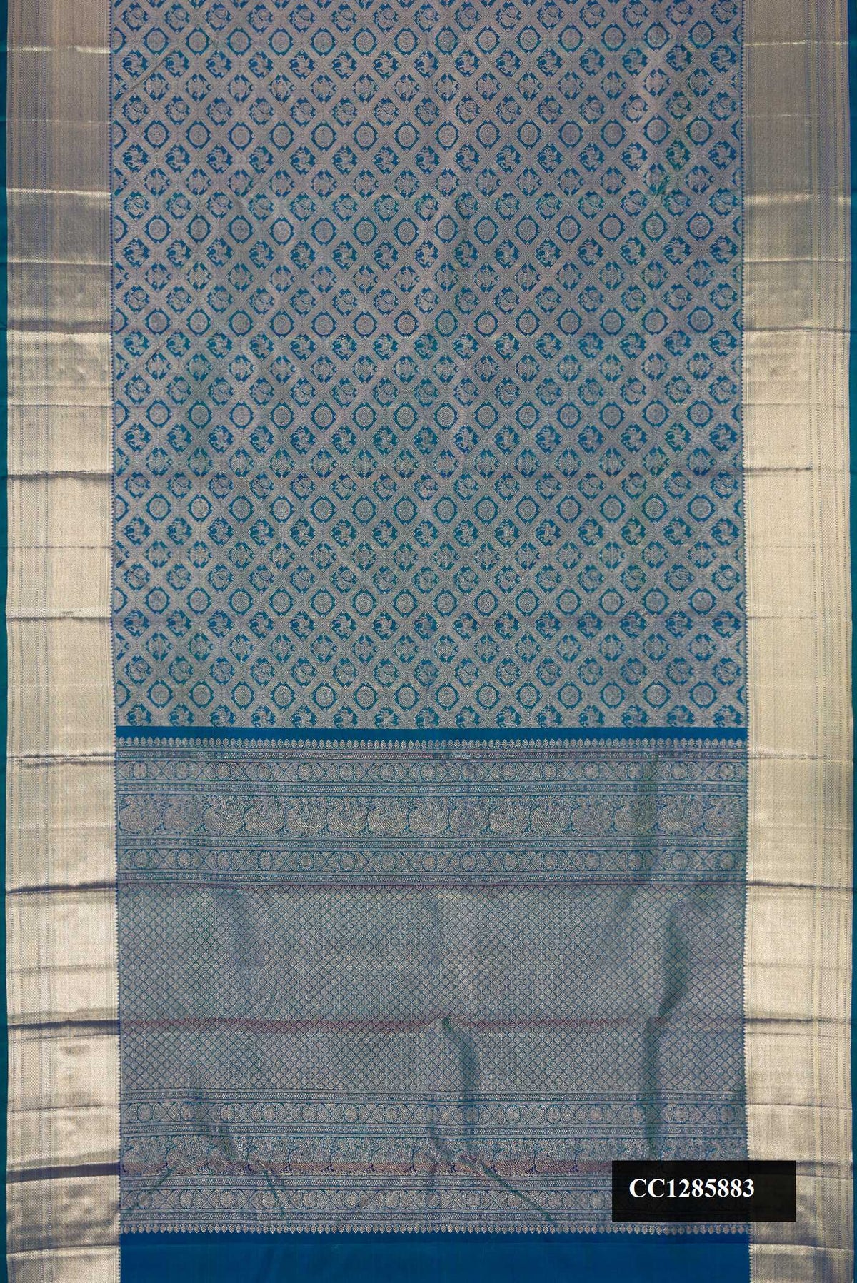 Peacock Blue Dual Tone Kanchipuram Silk Saree with Zari Brocade on the body and Zari Border.  displayed on a mannequin
