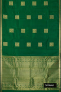 Bottle Green Dual Tone Kanchipuram Silk Saree with Zari Butta on the body and Zari Border.  displayed on a mannequin