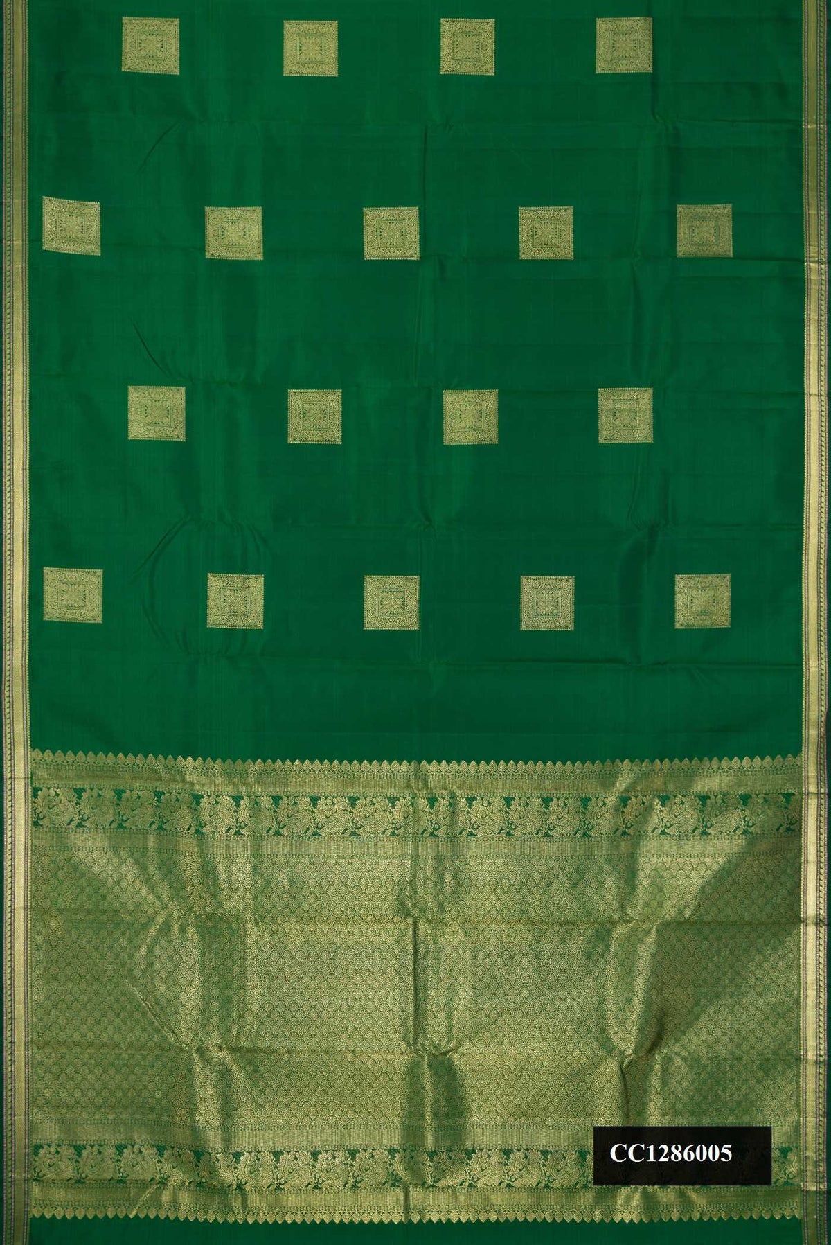 Bottle Green Dual Tone Kanchipuram Silk Saree with Zari Butta on the body and Zari Border.  displayed on a mannequin