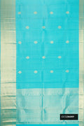 Sky Blue Dual Tone Kanchipuram Silk Saree with Checked design on the body and Zari Border.  displayed on a mannequin