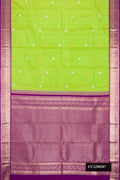 Parrot Green Dual Tone Kanchipuram Silk Saree with Zari Butta on the body and Zari Border.  displayed on a mannequin