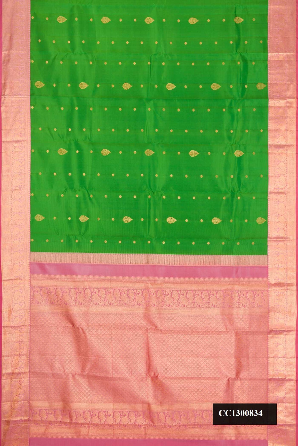 Green Dual Tone Kanchipuram Silk Saree with Zari Butta on the body and Zari Border.  displayed on a mannequin