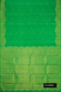 Green Dual Tone Kanchipuram Silk Saree with Zari Butta on the body and Fancy Border.  displayed on a mannequin