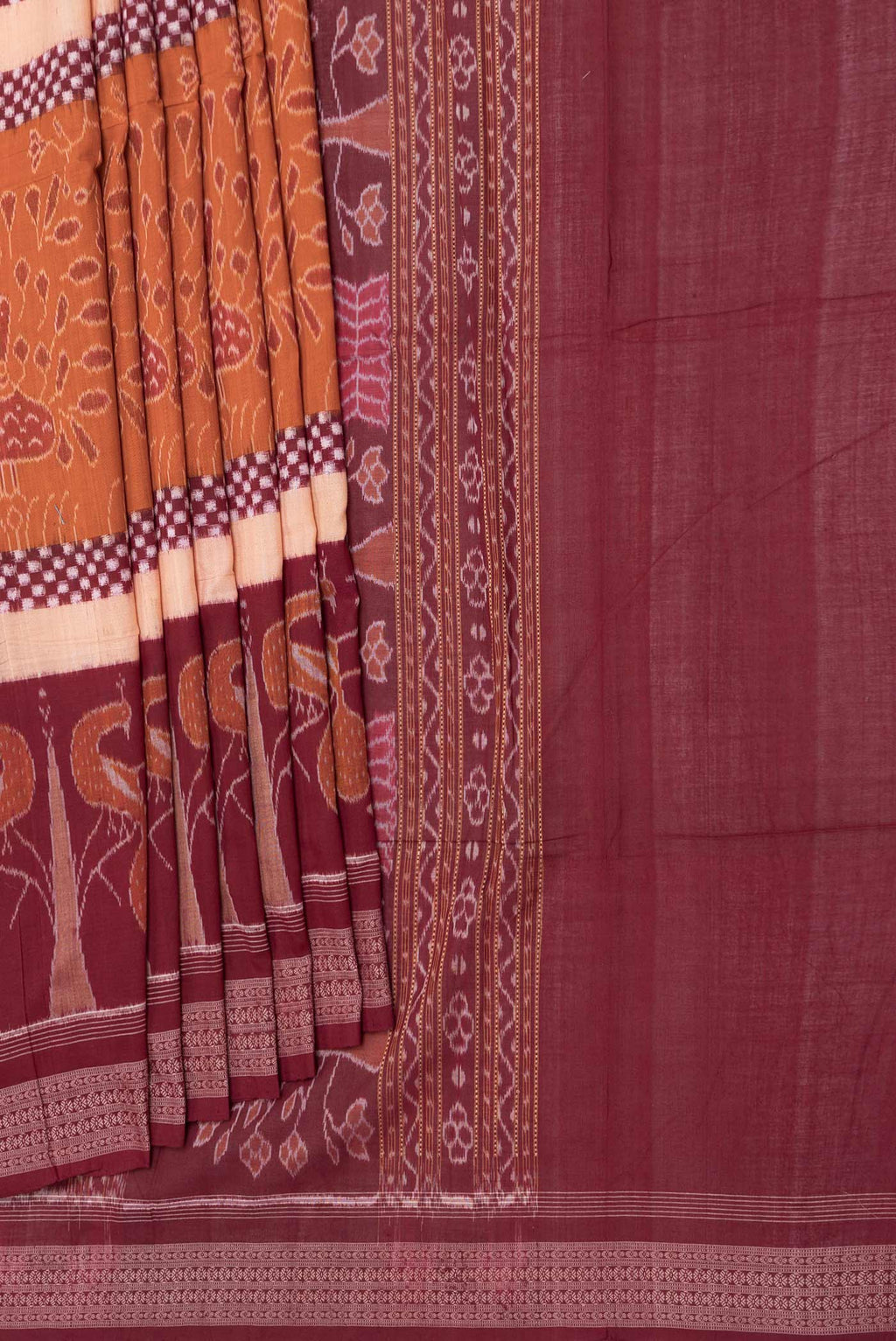 Pleats and pallu of Orange Dual Tone Double Ikat Saree with Ikat Print on the body and Ikat Border