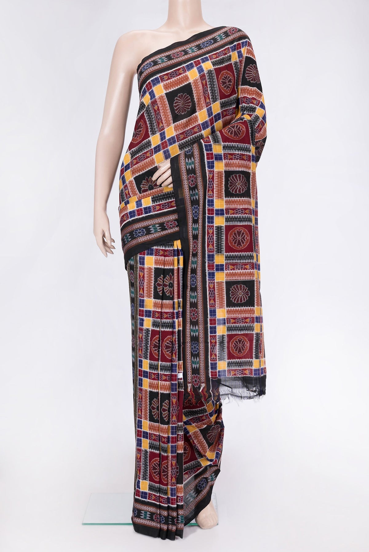Black and Maroon Color Double Ikat Saree with Ikat Print on the body and Thread Border.  displayed on a mannequin