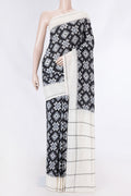 Black Dual Tone Double Ikat Saree with Ikat Print on the body and Plain Border displayed on a mannequin