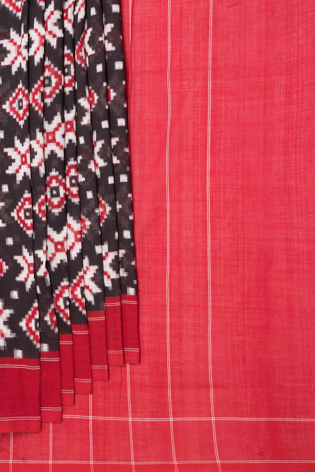 Pleats and pallu of Black Dual Tone Double Ikat Saree with Ikat Print on the body and Plain Border