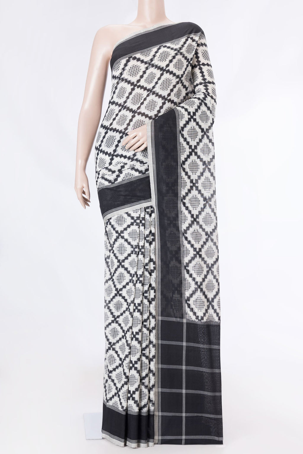 Off White Dual Tone Double Ikat Saree with Ikat Print on the body and Plain Border displayed on a mannequin