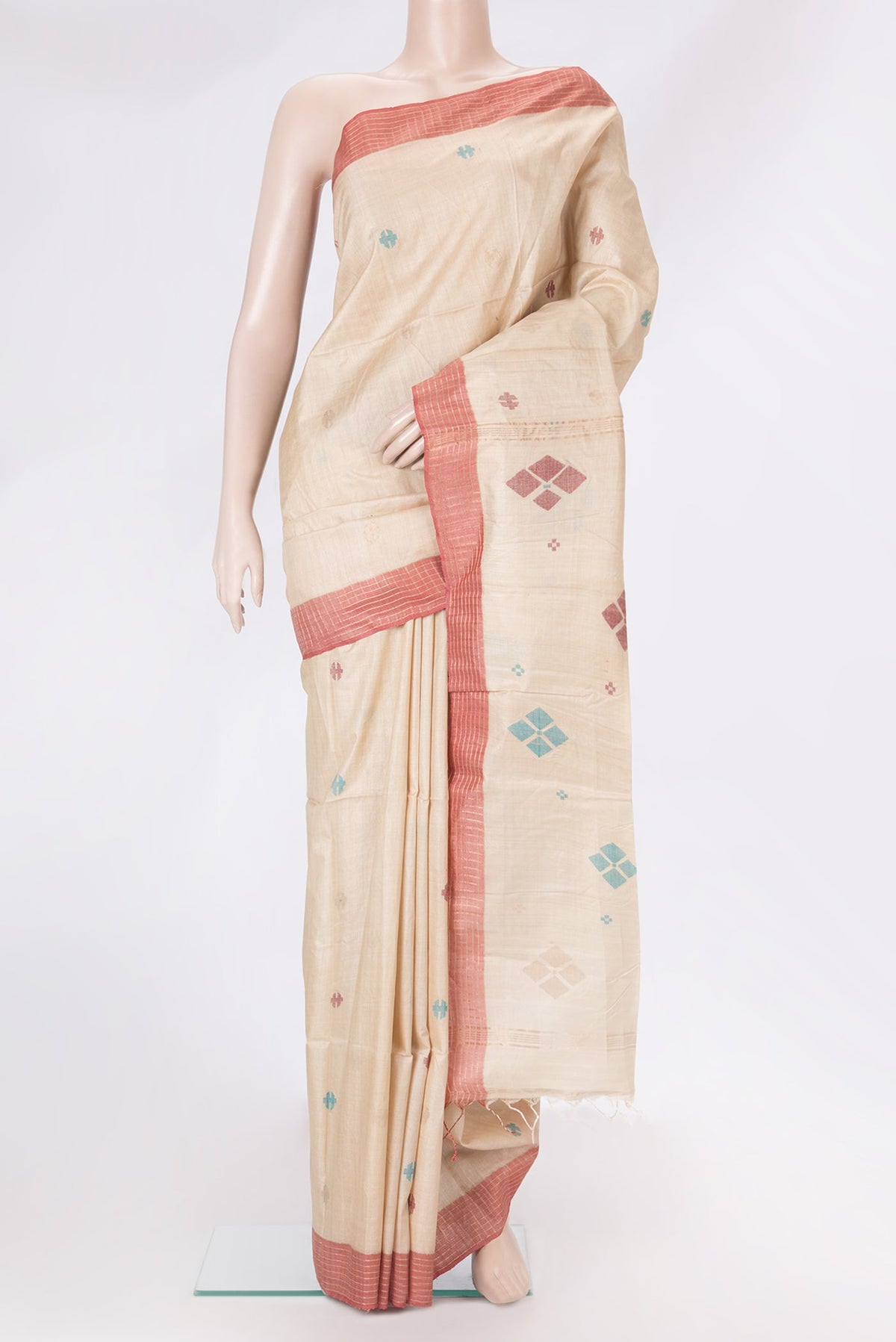 Beige Tussar Silk Saree with Thread Butta on the body and Plain Border.  displayed on a mannequin
