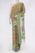 Mustard Dual Tone Tussar Silk Saree with kalamkari Print on the body and Zari Border.  displayed on a mannequin