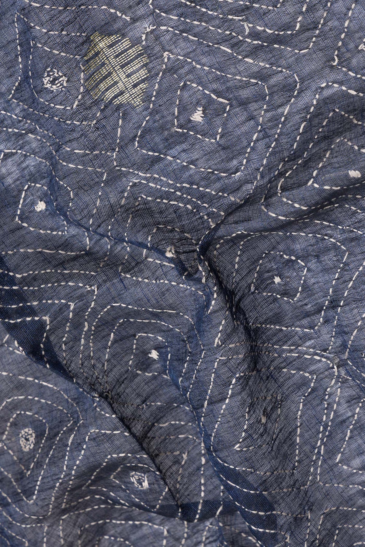 Close up of Navy Blue Dual Tone Tussar Silk Saree with Embroidery on the body and Plain Border.  displaying folds