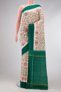 Off White Dual Tone Double Ikat Saree with Ikat Print on the body and Plain Border.  displayed on a mannequin