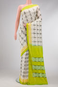 Off White Dual Tone Double Ikat Saree with Ikat Print on the body and Plain Border.  displayed on a mannequin