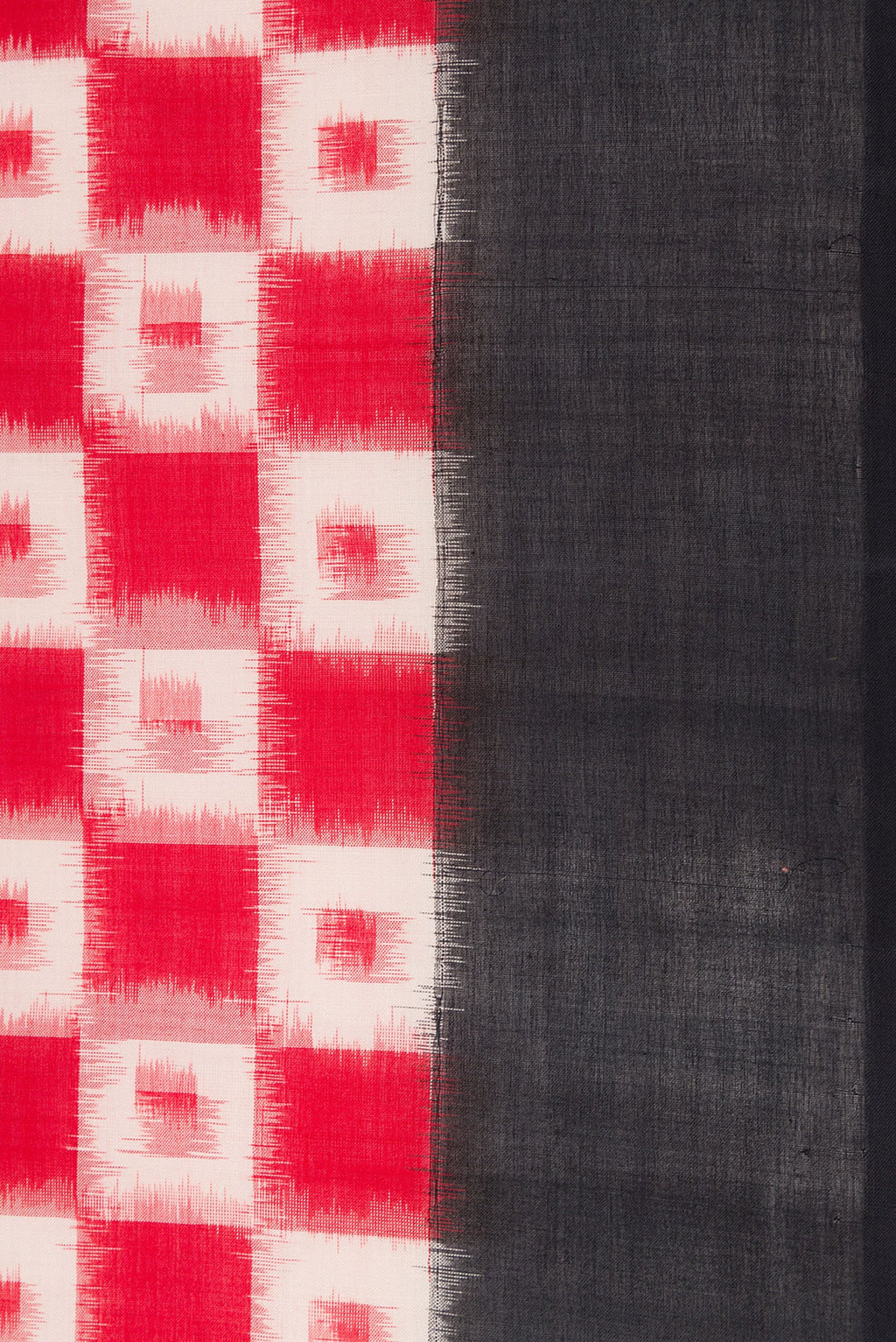 Border image of Red Dual Tone Double Ikat Saree with Ikat Print on the body and Plain Border. 