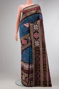 Blue Dual Tone Double Ikat Saree with Ikat Print on the body and Thread Border.  displayed on a mannequin