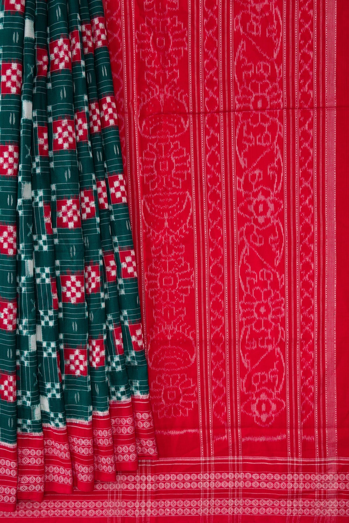 Pleats and pallu of Bottle Green Dual Tone Double Ikat Saree with Ikat Print on the body and Thread Border. 