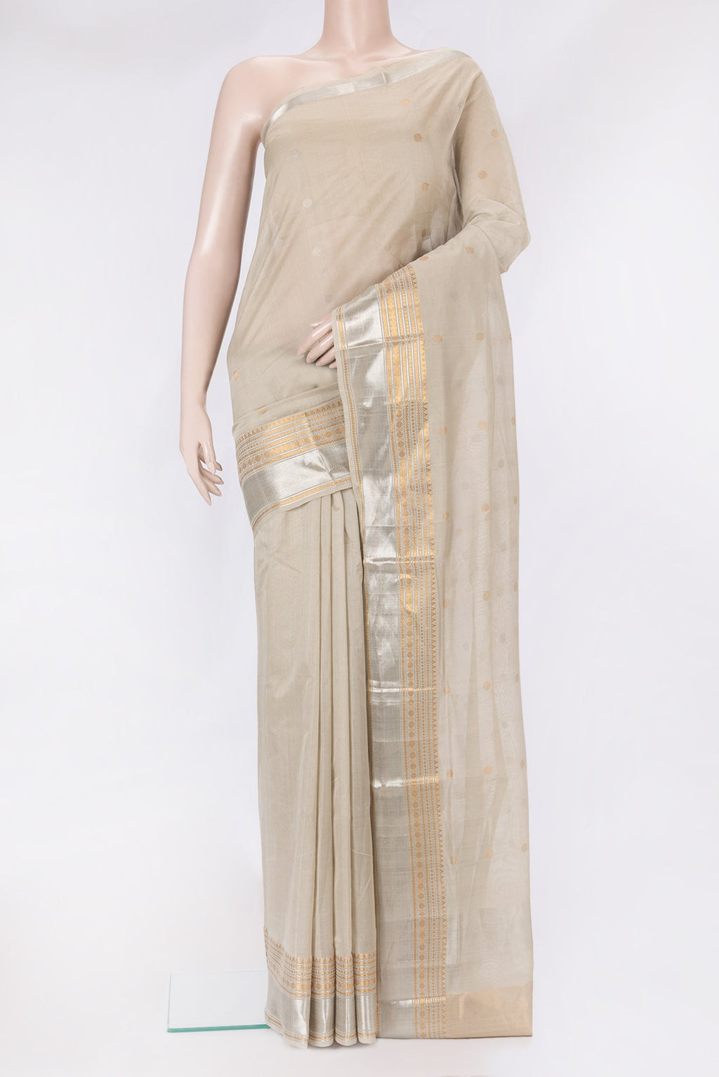 Beige Uppada Cotton Saree with Zari Butta on the body and Zari Border.  displayed on a mannequin