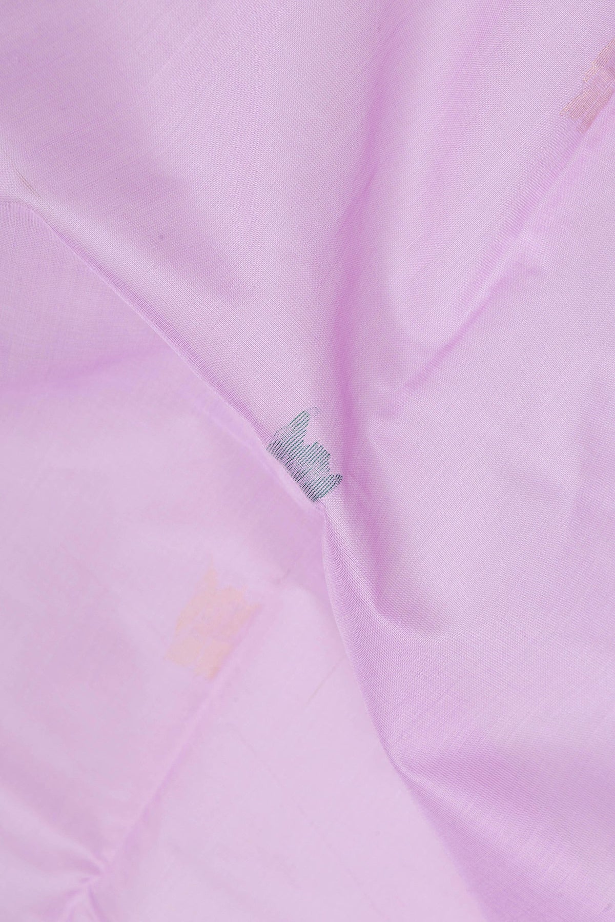 Close up of Lavender Uppada Cotton Saree with Zari And Thread Butta on the body and Zari Border.  displaying folds