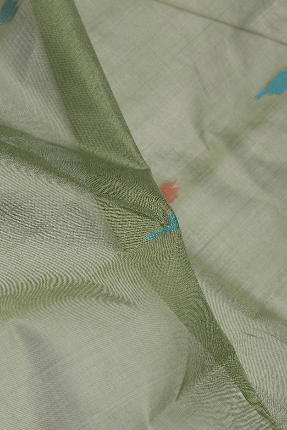 Close up of Mehandi Green Uppada Cotton Saree with Thread Butta on the body and Zari Border.  displaying folds