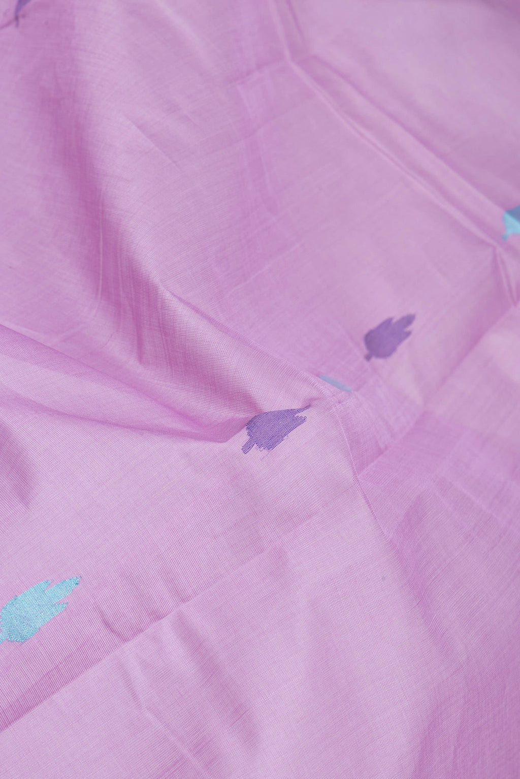 Close up of Lavender Uppada Cotton Saree with Thread Butta on the body and Zari Border.  displaying folds