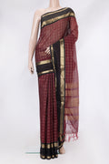 Maroon Dual Tone Silk Cotton Saree with Checked design on the body and Zari Border.  displayed on a mannequin