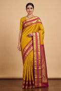 Model wearing a Yellow Kanchipuram Silk Saree