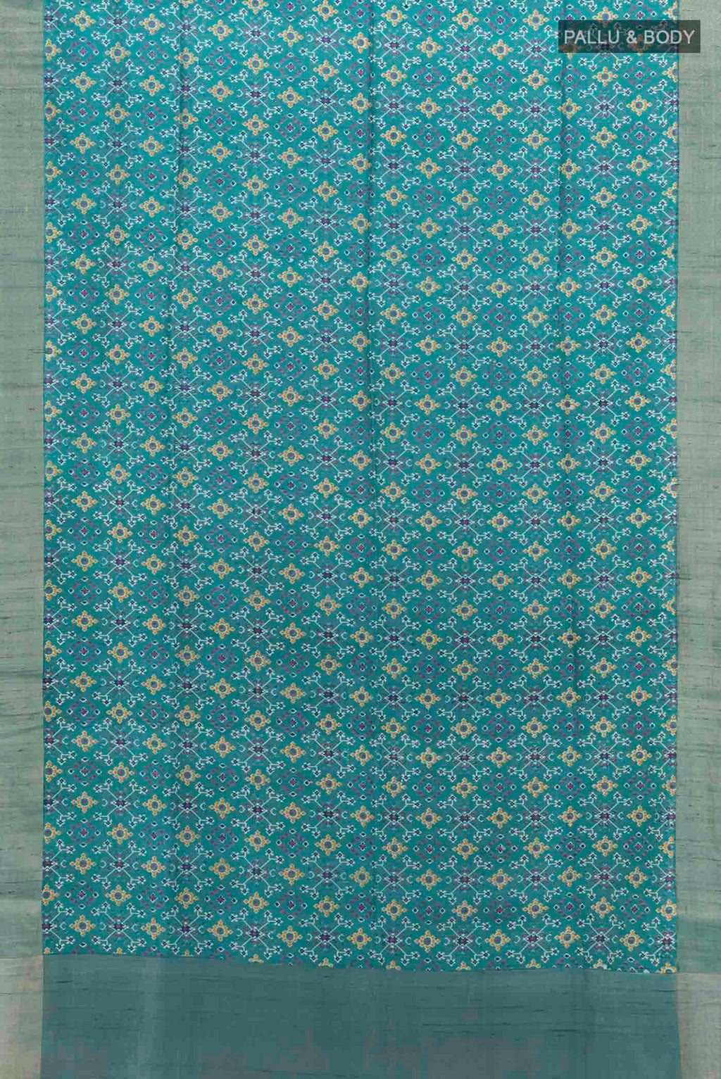 Flat view of Blue Tussar Silk Saree with Ikat Print on the body and Zari Border