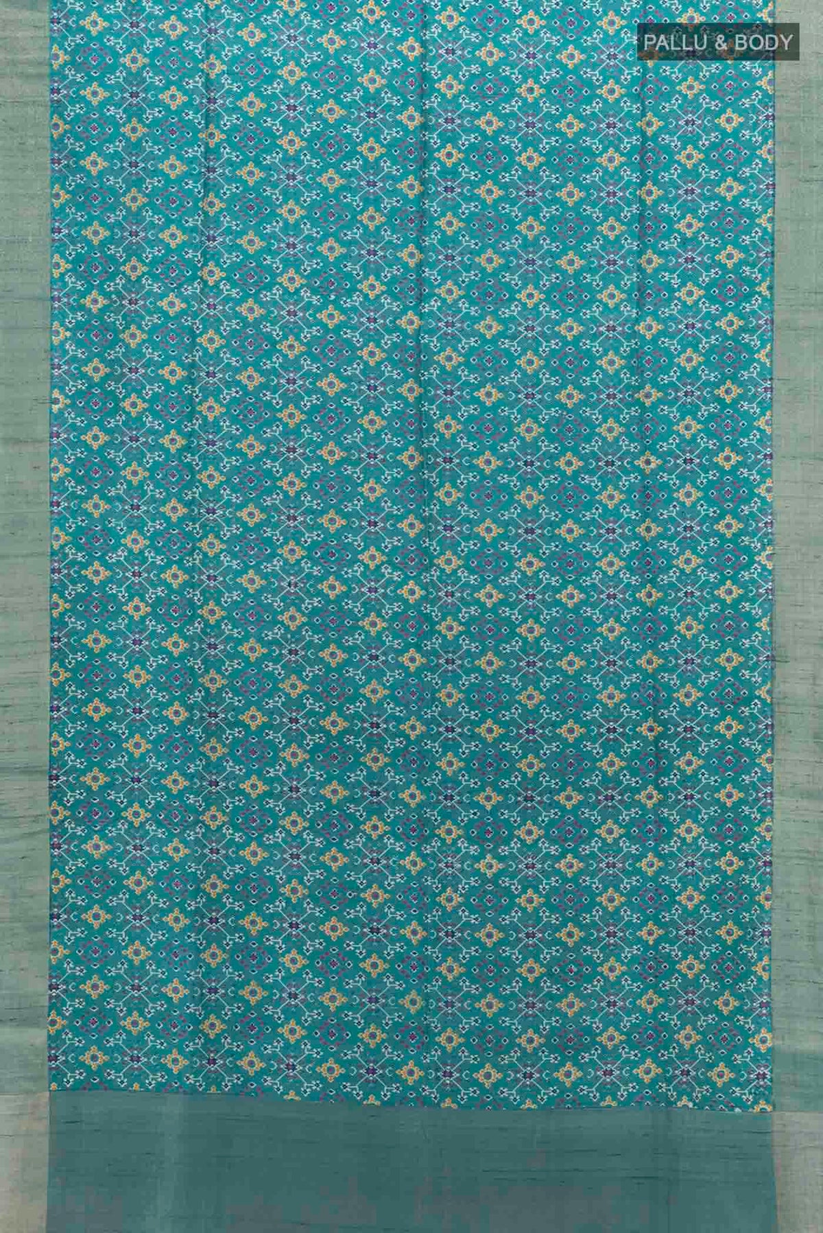 Flat view of Blue Tussar Silk Saree with Ikat Print on the body and Zari Border