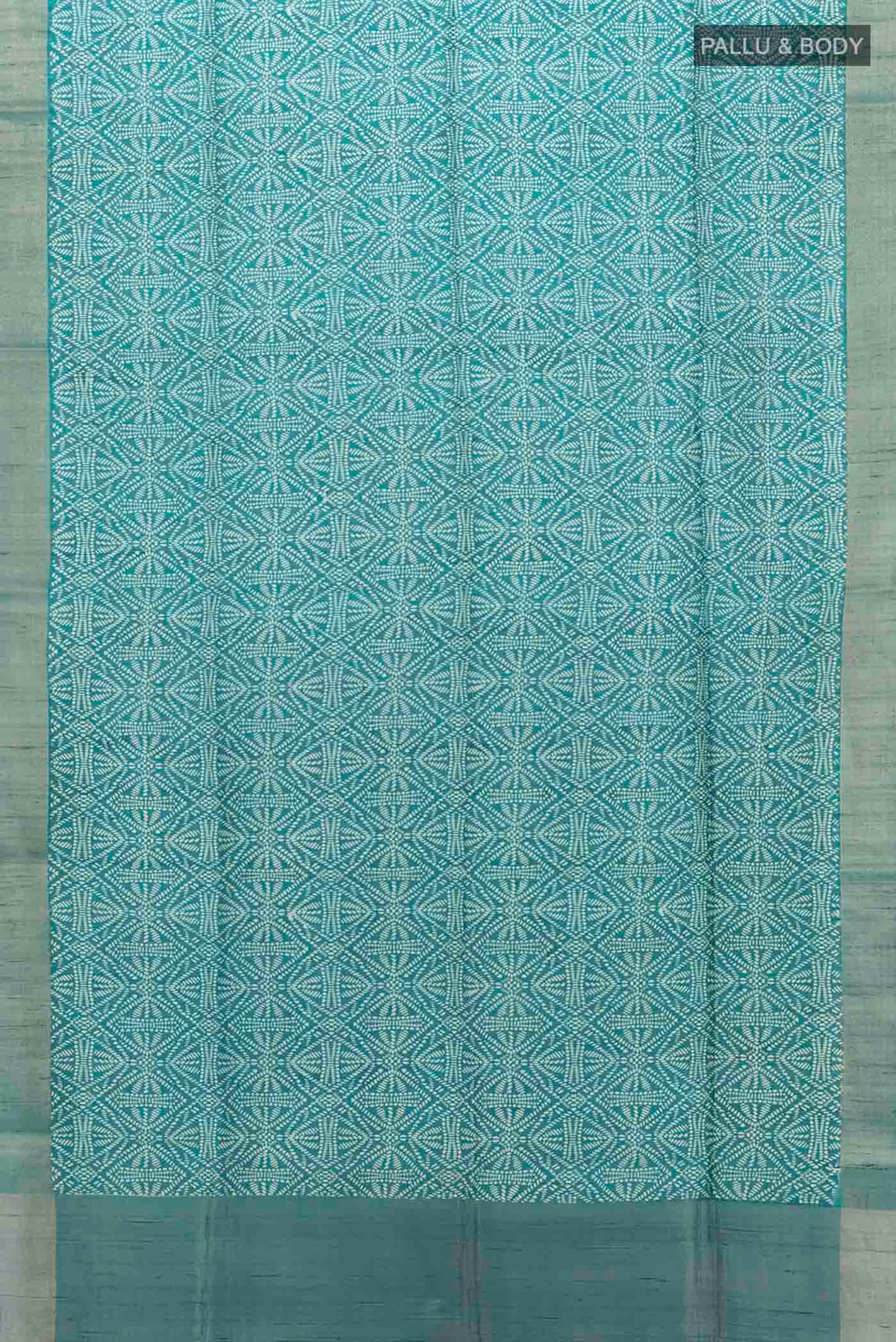 Flat view of Blue Tussar Silk Saree with Printed design on the body and Zari Border
