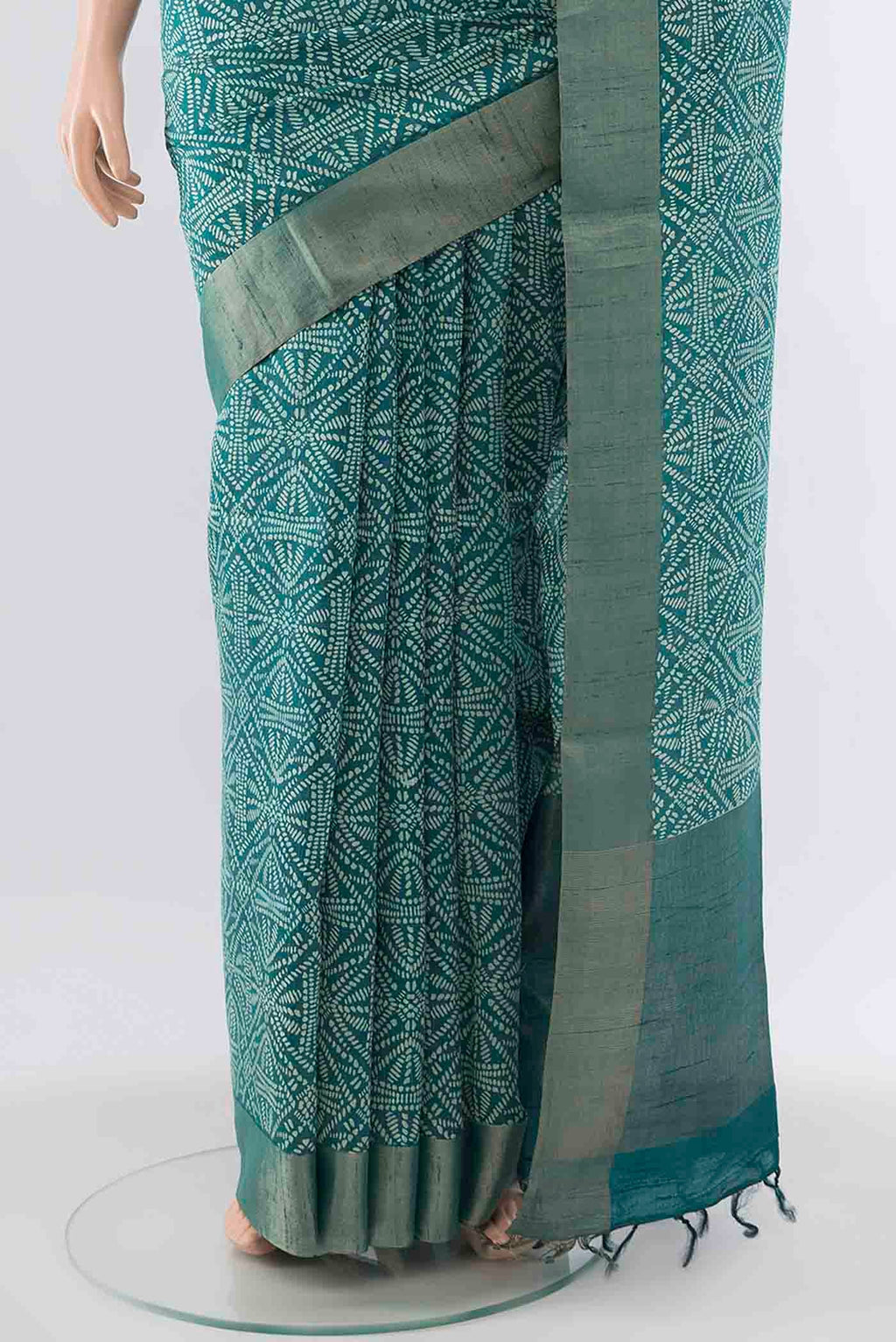 Pleats and pallu of Blue Tussar Silk Saree with Printed design on the body and Zari Border