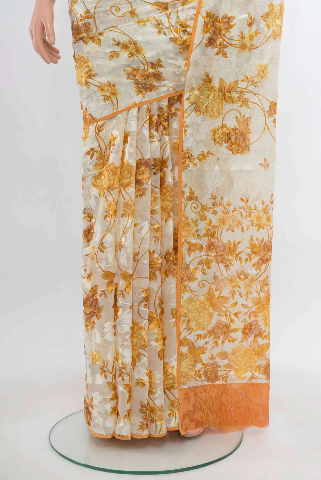 Pleats and pallu of Off White Chiffon Saree with Zari Butta on the body and Silk Border. 