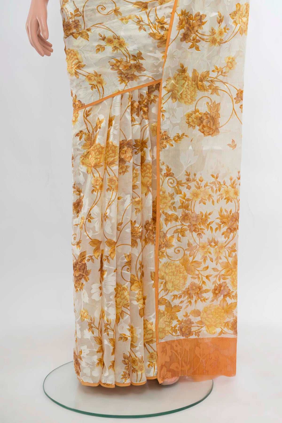 Pleats and pallu of Off White Chiffon Saree with Zari Butta on the body and Silk Border. 
