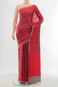 Red Printed Silk Saree with Floral Print on the body and Silk Border displayed on a mannequin