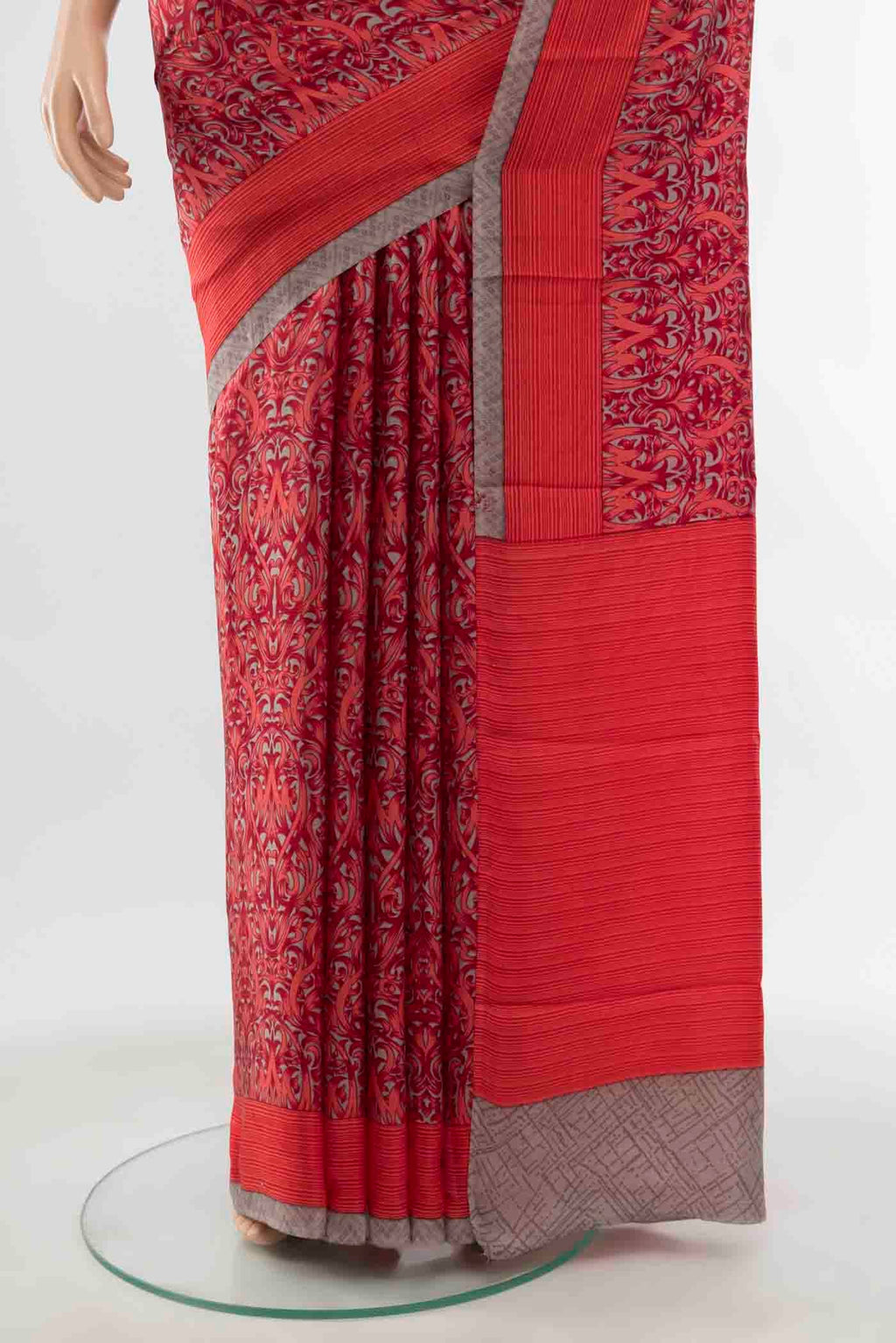 Pleats and pallu of Red Printed Silk Saree with Floral Print on the body and Silk Border