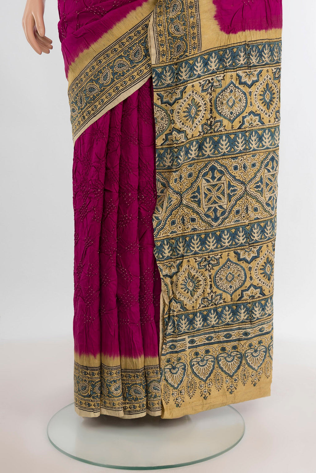 Pleats and pallu of Magenta Bandhani Silk Saree with Bandhani on the body and Printed Border. 