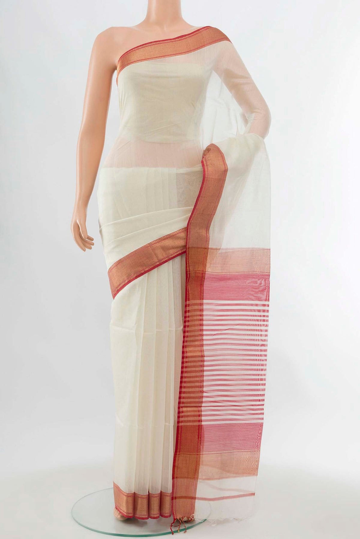 Cream Maheshwari Silk Cotton Saree with Zari Butta on the body and Silk Border displayed on a mannequin