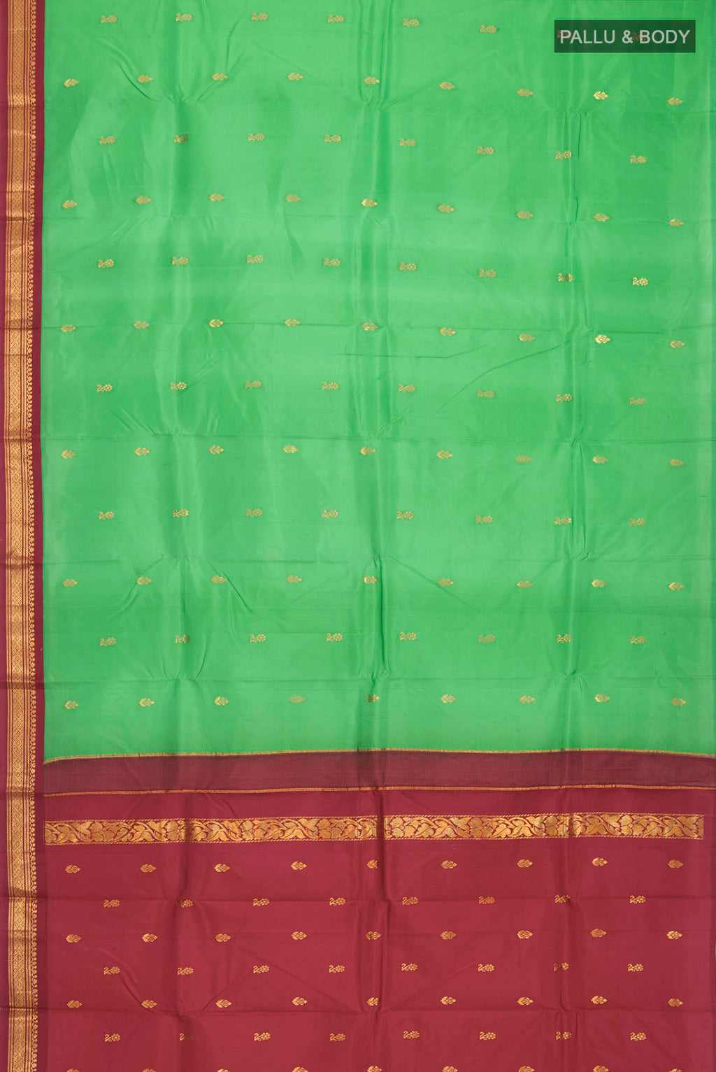 Flat view of Green Kanchipuram Silk Saree with Zari Butta on the body and One Side Border