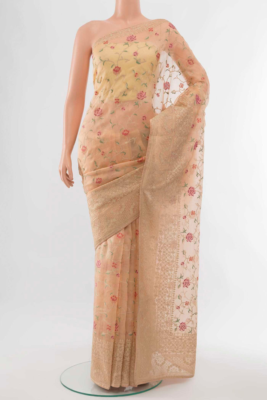 Peach Tussar Silk Saree with Embroidery on the body and Embroidery Border displayed on a mannequin